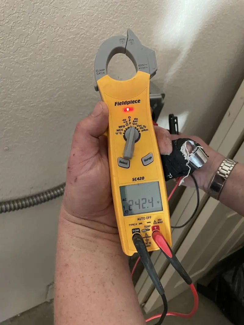 Voltage testing with clamp meter during Electrical Installation Services in Center